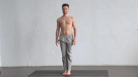 A young strong man doing yoga exercises. Stock Footage 71240022
