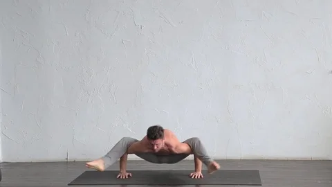 A young strong man doing yoga exercises. Studio shot Stock Footage 71240360