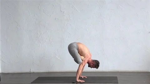 A young strong man doing yoga exercises. Studio shot Stock Footage 71240381