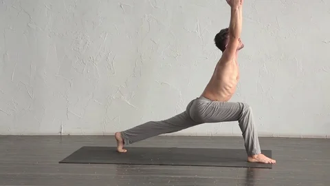 A young strong man doing yoga exercises. Studio shot Stock Footage 71240488