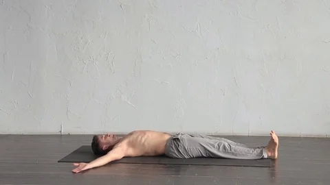 A young strong man doing yoga exercises. Studio shot Stock Footage 71240789