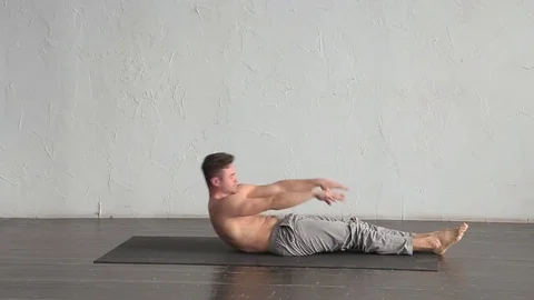A young strong man doing yoga exercises. Studio shot Stock Footage 71240825