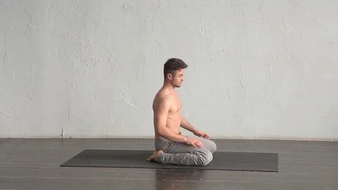 A young strong man doing yoga exercises. Studio shot Stock Footage 71240898