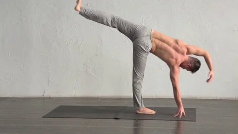 A young strong man doing yoga exercises. Studio shot Stock Footage 71240952