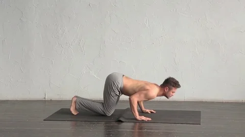 A young strong man doing yoga exercises. Studio shot Stock Footage 71240991