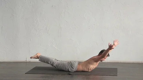 A young strong man doing yoga exercises. Studio shot Stock Footage 71240997