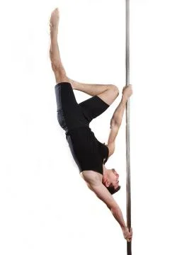 Young strong pole dancer smiling man in black clothes on pylon. White backgro Stock Photos