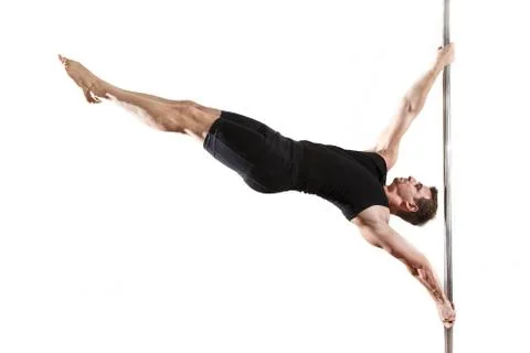 Young strong pole dancer smiling man in black clothes on pylon. White backgro Stock Photos