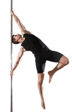 Young strong pole dancer smiling man in black clothes on pylon. White backgro Stock Photos