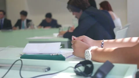 Young student in the background keeping waiting for the end of the disscusion Stock Footage 56910922