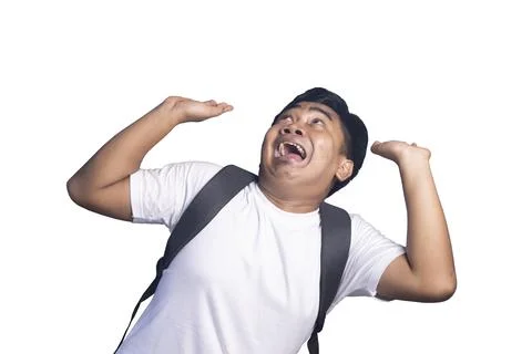 Young student with a backpack looks up with a scared and fearful expression.. Stock Photos