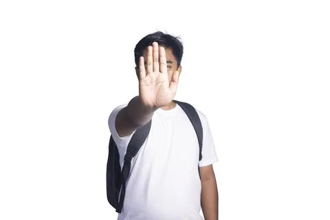 Young student with a backpack making a stop gesture with his hand covering .. Stock-Fotos