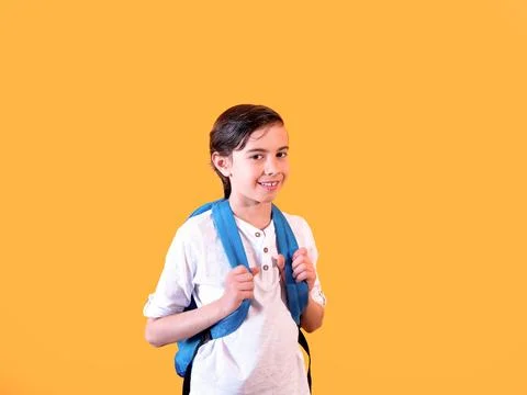 Young Student with Backpack on Orange Background Stock Photos