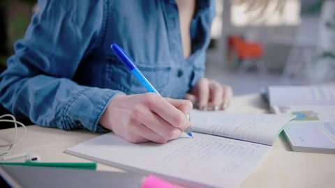 Young student can't concentrate on studying with smartphone hesitate distraction Stock Footage 103290942