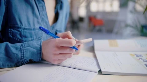 Young student can't concentrate on studying with smartphone hesitate distraction Video stock 103291022
