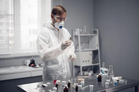 Young student, chemist experimenting in a school lab Stock Photos