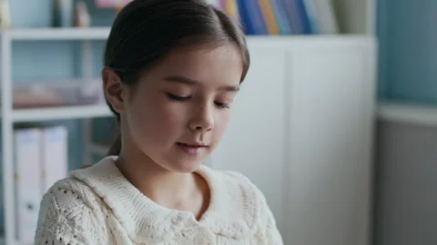 Young Student Deep in Thought While Completing Classroom Worksheet Stock Footage 312049766