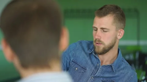 A young student discusses the lecture with students Stock Footage 67718669
