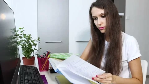 A young student is doing distance learning from the home. Stock Footage 157304191