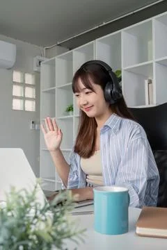 Young Student Engaged in Online Learning at Home with Laptop and Headphones Stock Photos