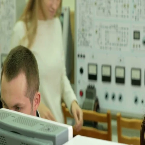 Young student engineers team work in the University of the electrical laboratory Stock Footage 69464922
