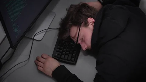 Young student of Faculty on Information Technology is sleeping on keyboard in Stock-Footage 72425378