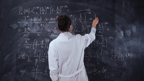 Young student female solve hard equation on black chalk board Stock Footage 79348152