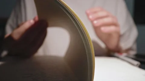Young student flip though white paper pages of homework notebook in slow motion Stock Footage 163252080