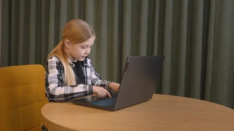 Young student girl using laptop for online education at home 스톡 동영상 315877358