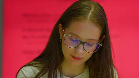 Young student with glasses studying thoughtfully Stock Footage 345839780