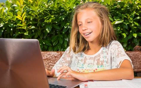 Young student happiness on the computer 库存照片
