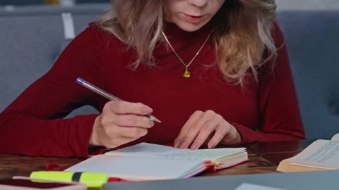 Young student highlighting text with a marker Stock Footage 202127426