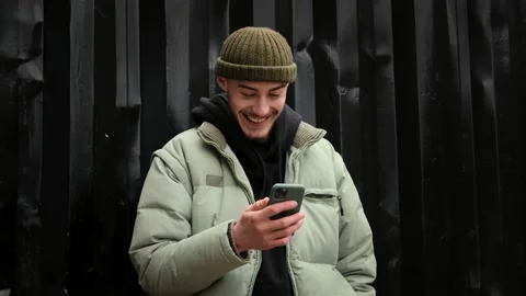 Young student hipster man using touch mobile phone Stock Footage 144261258