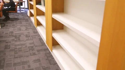 Young student learning at library. Stock Footage 80540614