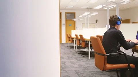 Young student learning at library. Stock Footage 80540616