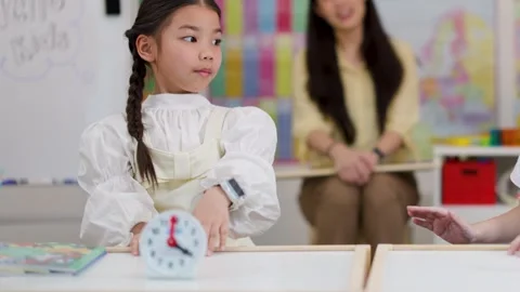 Young Student Learning to Tell Time with Clock Toy Stock Footage 331847391