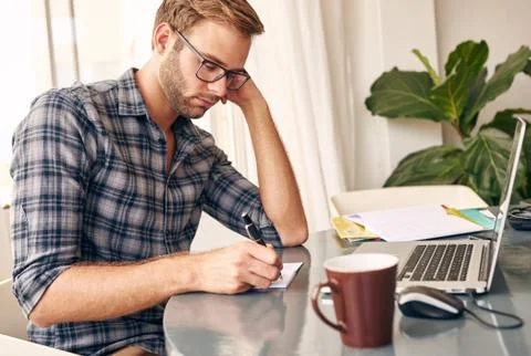 Young student making his To-Do List for the day Stock Photos