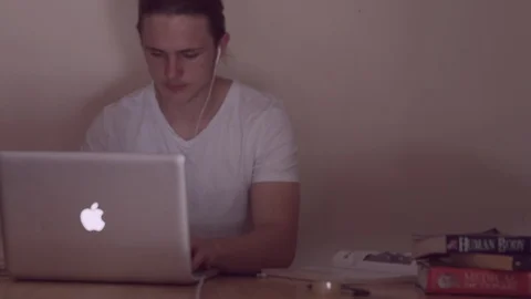 Young student man studying books and laptop, working  Stock Footage 85656068