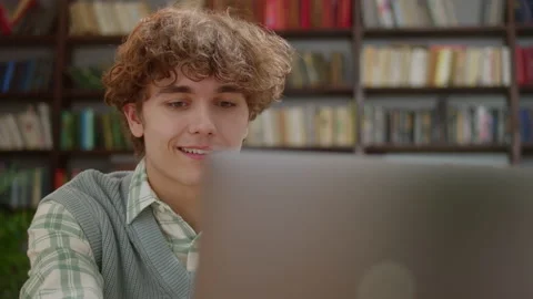 Young Student Man Working on Computer Doing Research at home. Casual Видео 171946294