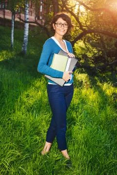 Young student with notebook. Online studying outdoors consept Stock Photos