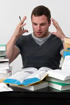 Young student overwhelmed with studying Stock Photos