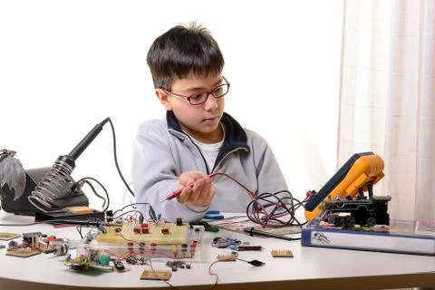 Young student performs experiments 写真素材