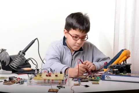 Young student performs experiments Stock Photos