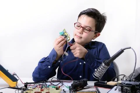 Young student performs experiments 写真素材