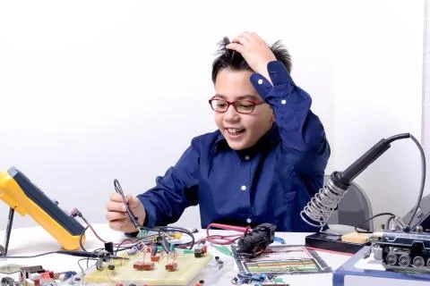 Young student performs experiments Stock Photos