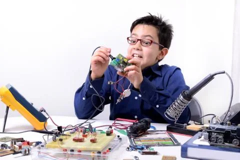 Young student performs experiments Stock Photos