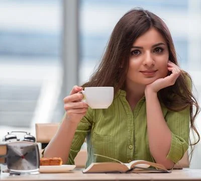 Young student preparing for exams drinking tea 写真素材