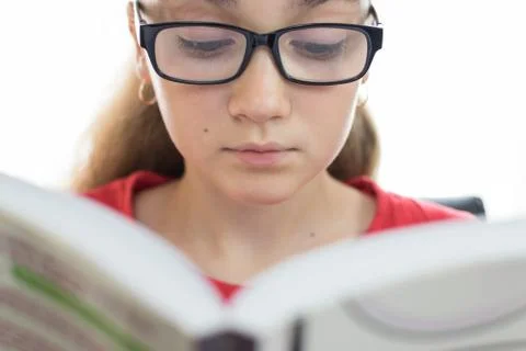 Young student reading a book Stock Photos