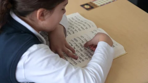 Young student reading Hebrew Torah Video stock 229651802