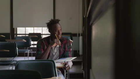 Young Student Solving Problems In College Classroom Stock Footage 210220582